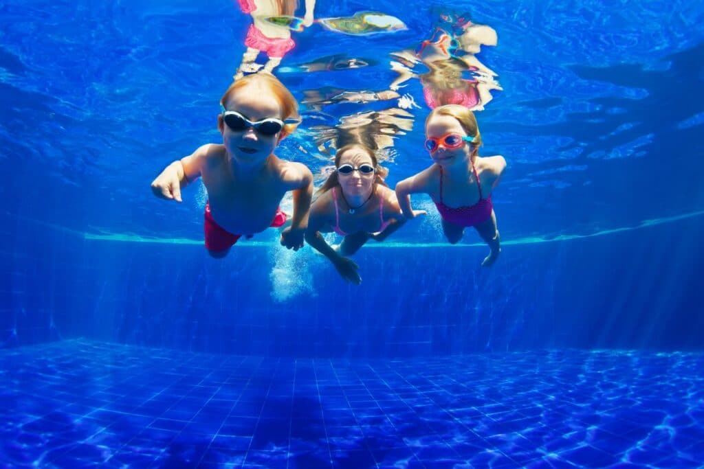 Kids swimming underwater