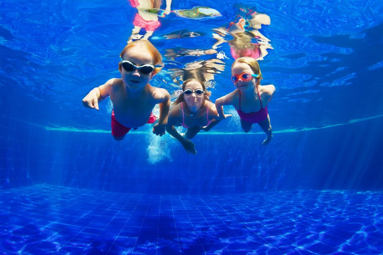 Kids swimming underwater