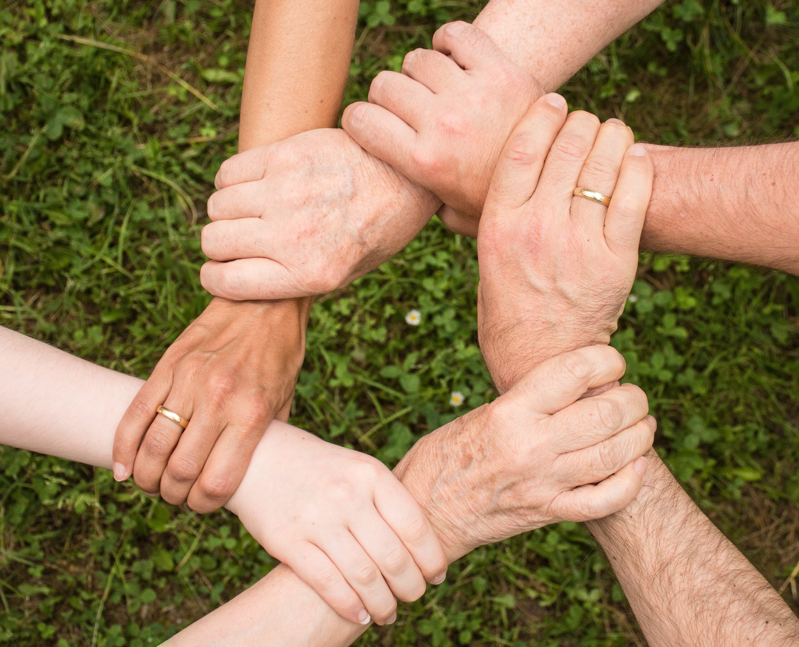 Community Joined together with hands in a hexagon