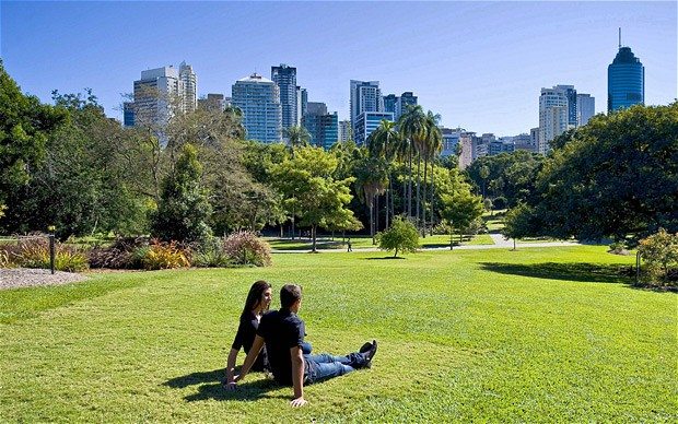 A couple relaxing on the grass at the City Botanic Gardens