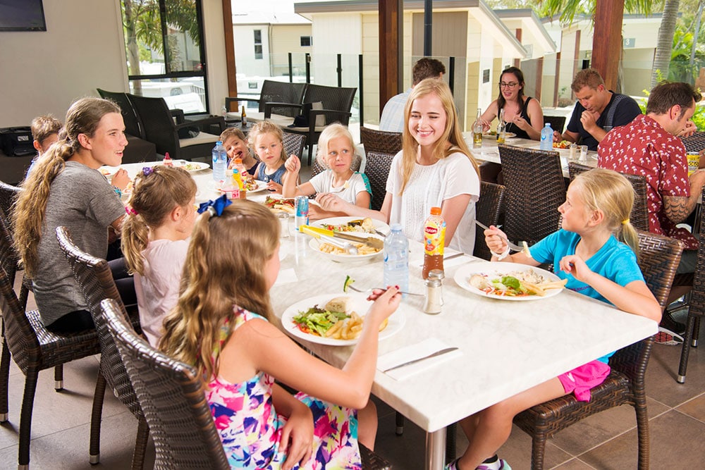 Teenagers and kids enjoying lunch at Lagoona Resort Restaurant