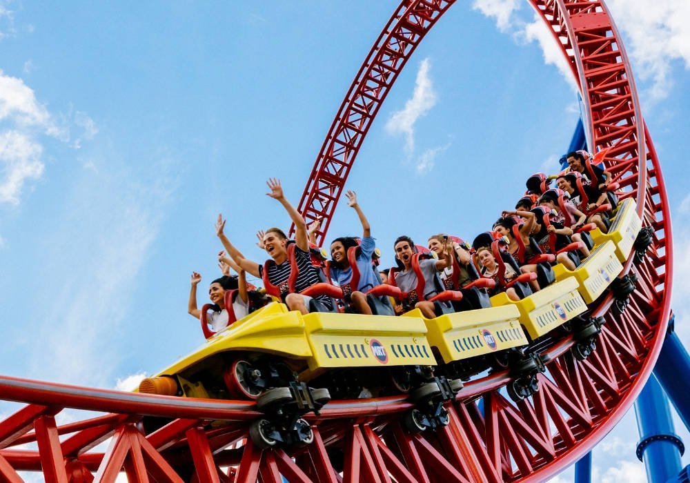 Side view of people on a roller coaster at Movieworld
