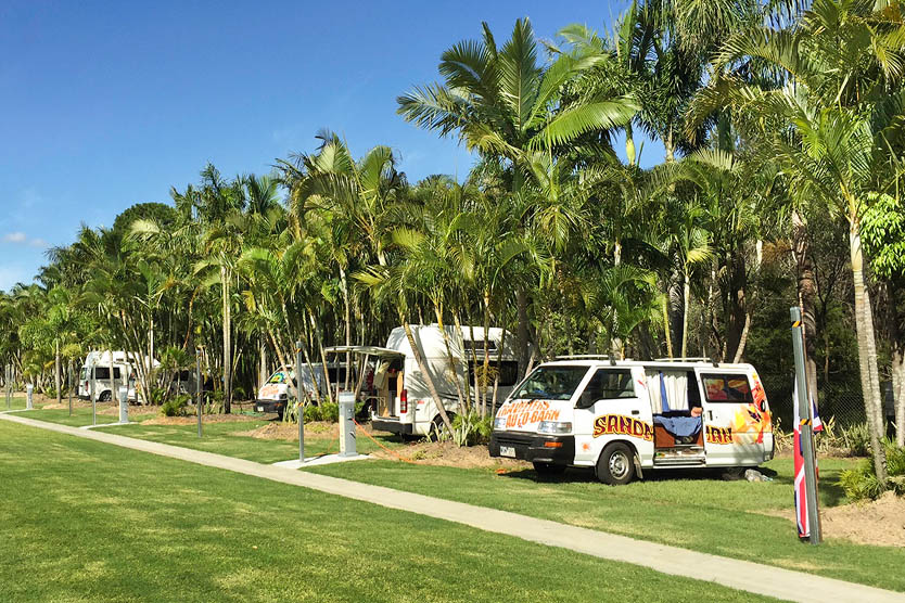 Powered tent and camping site with campervans at Brisbane Holiday Village