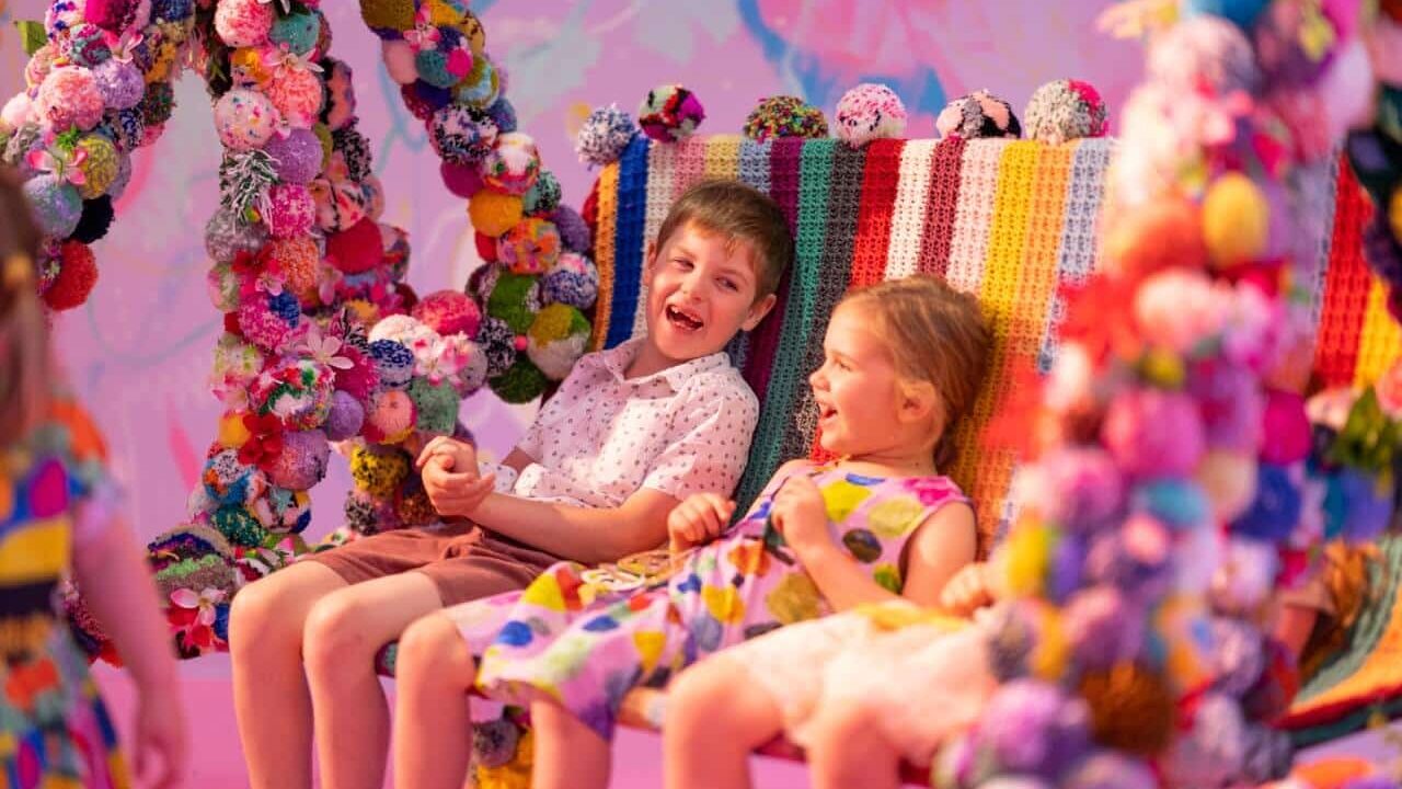 Children enjoying art exhibition at Queensland Museum in Brisbane