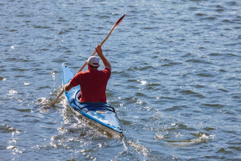 man kayaking down brisbane river